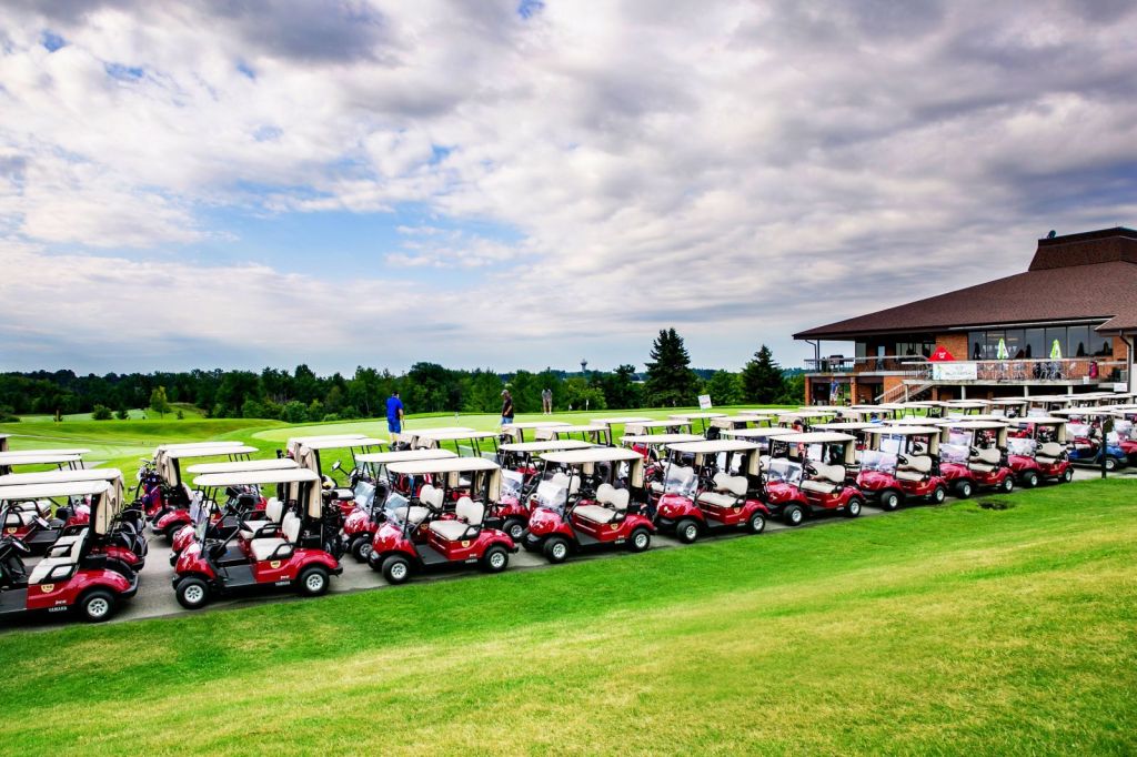 row of golf carts ready for event